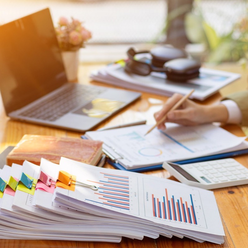 Insurance agent sitting at a desk with insurance paperwork