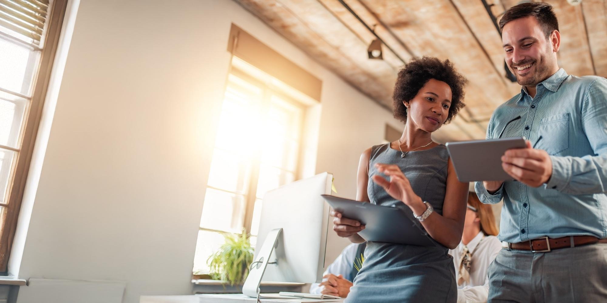 A woman and man talk about Insurance Careers